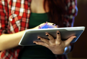 Girl with a tablet computer via iStock